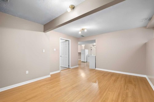 73 Sunset Heights, Cochrane, AB - Indoor Photo Showing Other Room