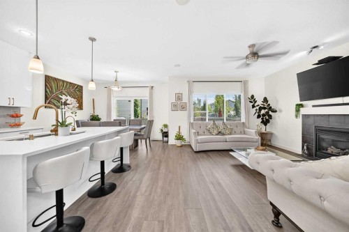279 Copperpond Circle Se, Calgary, AB - Indoor Photo Showing Living Room With Fireplace