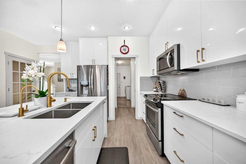 279 Copperpond Circle Se, Calgary, AB - Indoor Photo Showing Kitchen With Stainless Steel Kitchen With Double Sink With Upgraded Kitchen