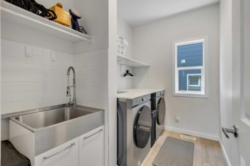 168 Magnolia Manor Se, Calgary, AB - Indoor Photo Showing Laundry Room