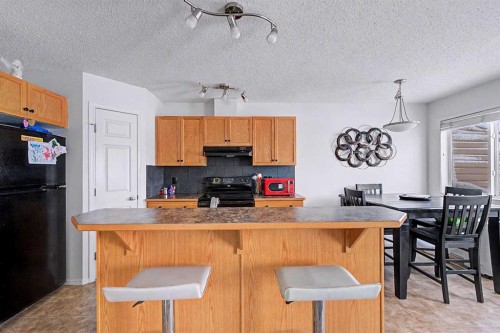 102-800 Yankee Valley Boulevard Se, Airdrie, AB - Indoor Photo Showing Kitchen