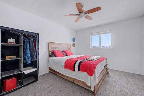 102-800 Yankee Valley Boulevard Se, Airdrie, AB - Indoor Photo Showing Bedroom