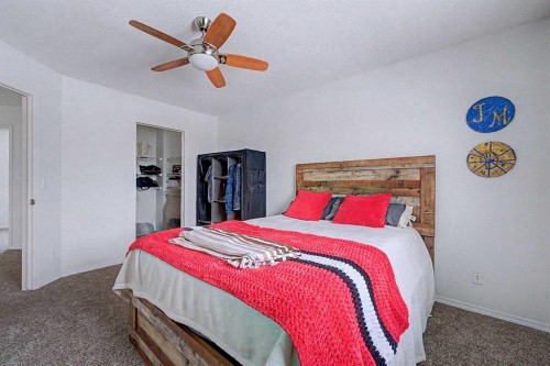 102-800 Yankee Valley Boulevard Se, Airdrie, AB - Indoor Photo Showing Bedroom