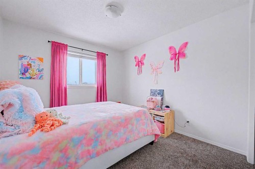 102-800 Yankee Valley Boulevard Se, Airdrie, AB - Indoor Photo Showing Bedroom