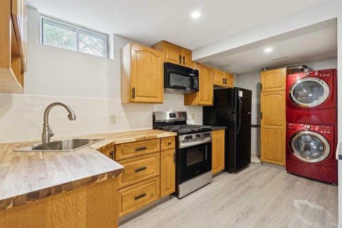 102 Thorson Crescent, Okotoks, AB - Indoor Photo Showing Laundry Room