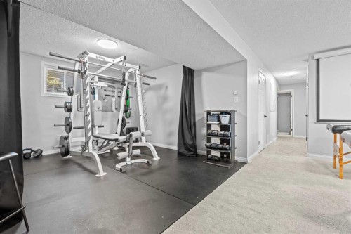 10619 Oakmoor Way Sw, Calgary, AB - Indoor Photo Showing Gym Room