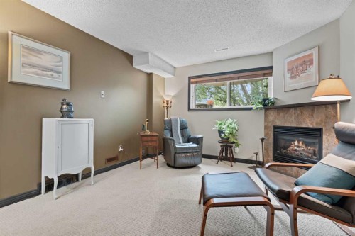 15 Lock Crescent, Okotoks, AB - Indoor With Fireplace