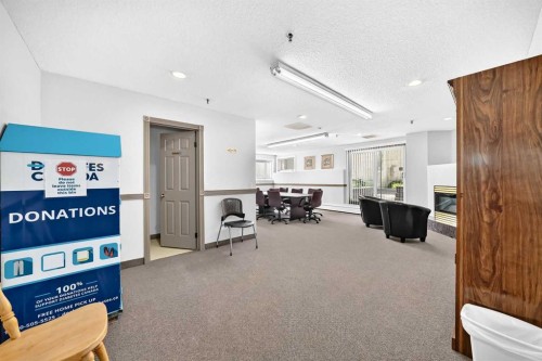 110-525 56 Avenue Sw, Calgary, AB - Indoor Photo Showing Other Room