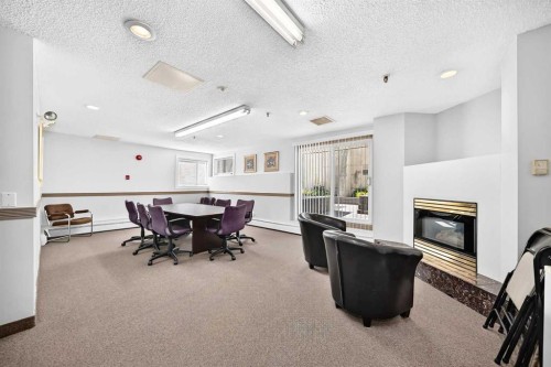 110-525 56 Avenue Sw, Calgary, AB - Indoor With Fireplace