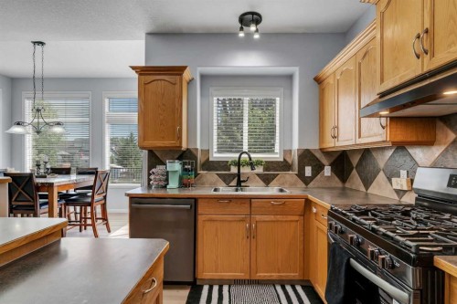 54 Thomas Street Nw, Langdon, AB - Indoor Photo Showing Kitchen With Double Sink