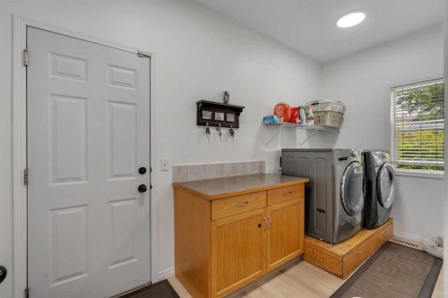 54 Thomas Street Nw, Langdon, AB - Indoor Photo Showing Laundry Room
