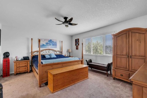 54 Thomas Street Nw, Langdon, AB - Indoor Photo Showing Bedroom
