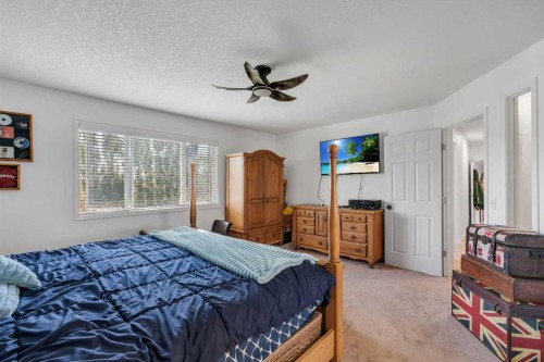 54 Thomas Street Nw, Langdon, AB - Indoor Photo Showing Bedroom