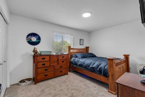 54 Thomas Street Nw, Langdon, AB - Indoor Photo Showing Bedroom