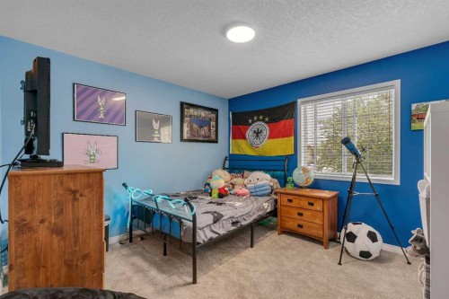 54 Thomas Street Nw, Langdon, AB - Indoor Photo Showing Bedroom