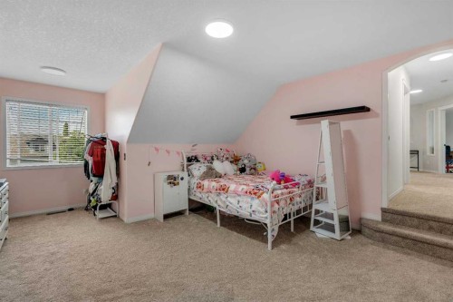 54 Thomas Street Nw, Langdon, AB - Indoor Photo Showing Bedroom