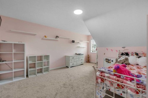 54 Thomas Street Nw, Langdon, AB - Indoor Photo Showing Bedroom