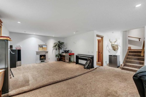 54 Thomas Street Nw, Langdon, AB - Indoor With Fireplace