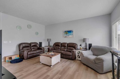 54 Thomas Street Nw, Langdon, AB - Indoor Photo Showing Living Room