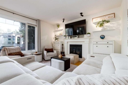 8631 Wentworth Drive Sw, Calgary, AB - Indoor Photo Showing Living Room With Fireplace