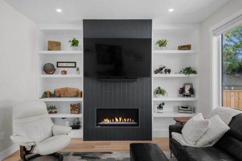 2407 33 Street Sw, Calgary, AB - Indoor Photo Showing Living Room With Fireplace