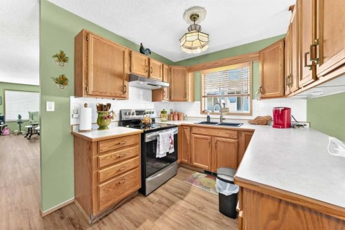 49-2821 Botterill Crescent, Red Deer, AB - Indoor Photo Showing Kitchen With Double Sink
