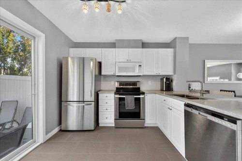 113 Tuscany Springs Gardens Nw, Calgary, AB - Indoor Photo Showing Kitchen With Stainless Steel Kitchen With Double Sink