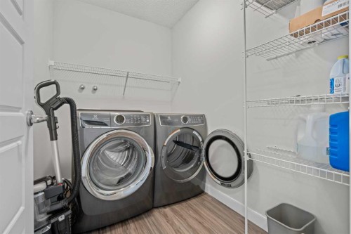 69 Carringvue Park Nw, Calgary, AB - Indoor Photo Showing Laundry Room