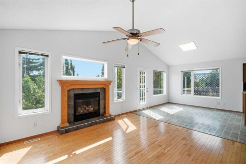 288 Springborough Way Sw, Calgary, AB - Indoor Photo Showing Living Room With Fireplace