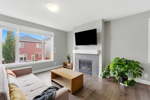 733 Windrow Manor Sw, Airdrie, AB - Indoor Photo Showing Living Room With Fireplace