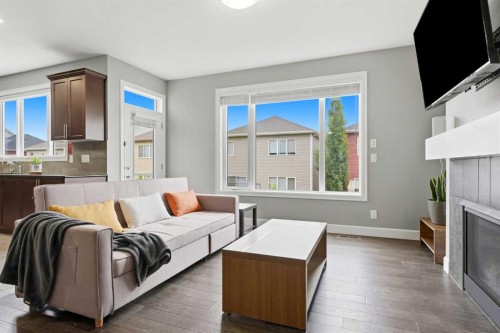 733 Windrow Manor Sw, Airdrie, AB - Indoor Photo Showing Living Room With Fireplace