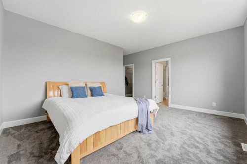 733 Windrow Manor Sw, Airdrie, AB - Indoor Photo Showing Bedroom