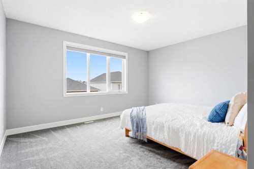 733 Windrow Manor Sw, Airdrie, AB - Indoor Photo Showing Bedroom