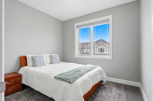 733 Windrow Manor Sw, Airdrie, AB - Indoor Photo Showing Bedroom