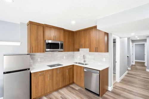 733 Windrow Manor Sw, Airdrie, AB - Indoor Photo Showing Kitchen With Stainless Steel Kitchen With Double Sink