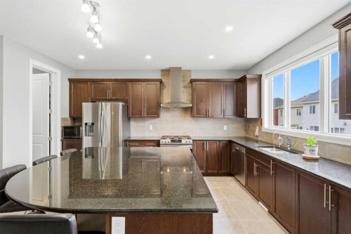 733 Windrow Manor Sw, Airdrie, AB - Indoor Photo Showing Kitchen With Stainless Steel Kitchen With Upgraded Kitchen