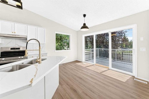 152 Harvest Park Terrace Ne, Calgary, AB - Indoor Photo Showing Kitchen With Double Sink