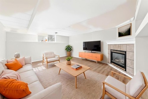 152 Harvest Park Terrace Ne, Calgary, AB - Indoor Photo Showing Living Room With Fireplace