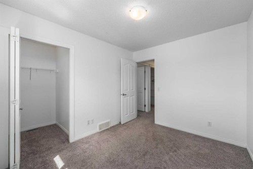 15 Panora Square Nw, Calgary, AB - Indoor Photo Showing Other Room