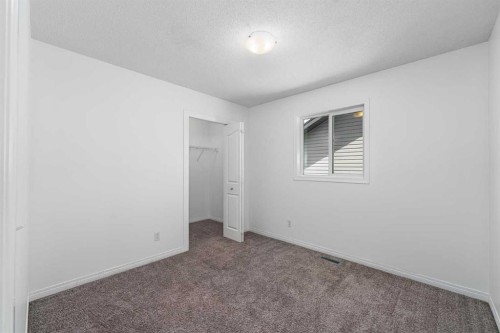 15 Panora Square Nw, Calgary, AB - Indoor Photo Showing Other Room
