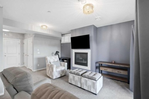 206 Lucas Crescent Nw, Calgary, AB - Indoor Photo Showing Living Room With Fireplace