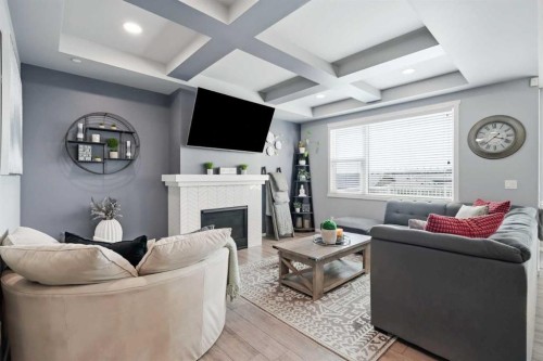 206 Lucas Crescent Nw, Calgary, AB - Indoor Photo Showing Living Room With Fireplace