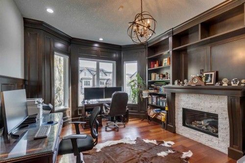 25 Aspenshire Close Sw, Calgary, AB - Indoor Photo Showing Living Room With Fireplace