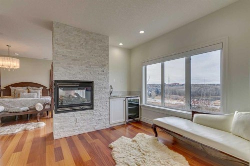 25 Aspenshire Close Sw, Calgary, AB - Indoor Photo Showing Living Room With Fireplace