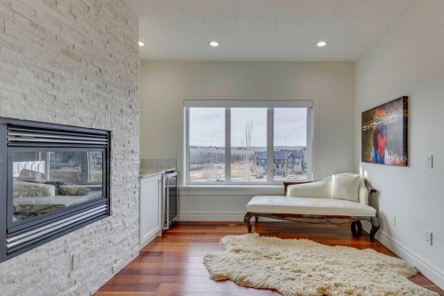 25 Aspenshire Close Sw, Calgary, AB - Indoor Photo Showing Living Room With Fireplace