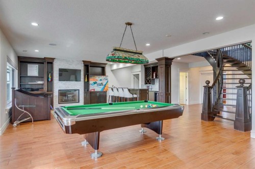 25 Aspenshire Close Sw, Calgary, AB - Indoor Photo Showing Other Room With Fireplace