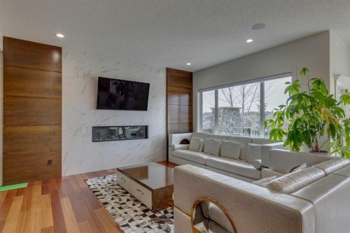25 Aspenshire Close Sw, Calgary, AB - Indoor Photo Showing Living Room With Fireplace