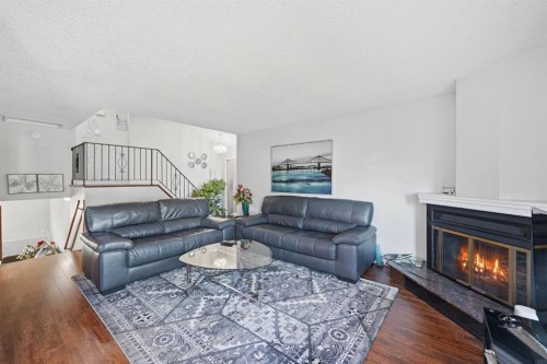 4 Fallswater Road Ne, Calgary, AB - Indoor Photo Showing Living Room With Fireplace