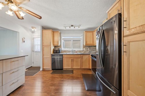 4 Fallswater Road Ne, Calgary, AB - Indoor Photo Showing Kitchen With Double Sink