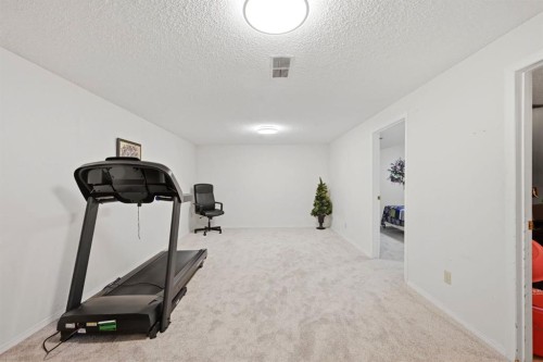 4 Fallswater Road Ne, Calgary, AB - Indoor Photo Showing Gym Room
